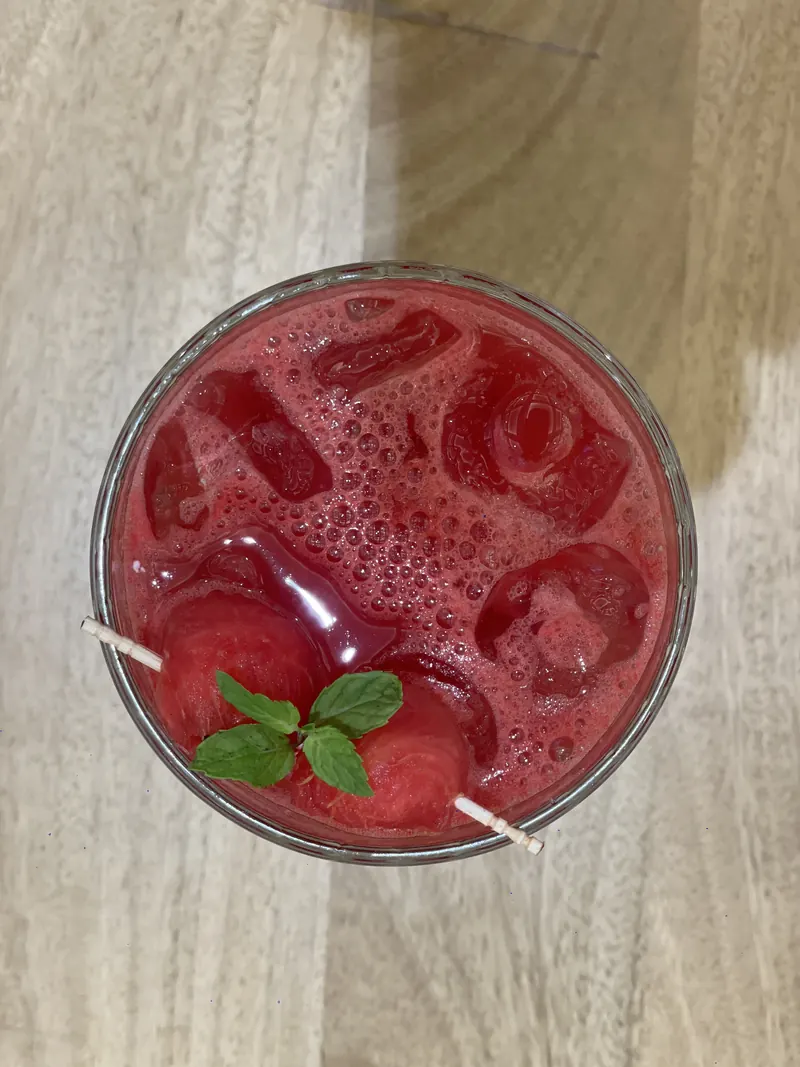 A red watermelon cooler seen from above